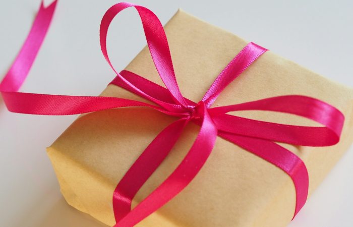 brown gift box with pink ribbon